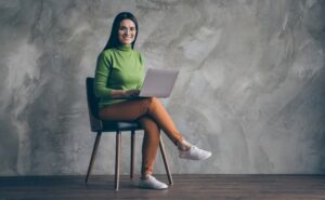 turned full length body size photo of cheerful girlfriend sitting in chair working with.jpg s=1024x1024&w=is&k=20&c=3kbf XhYH3zn0X6CunAQenVTqEr5A8xqD SjjwsZYJ8=